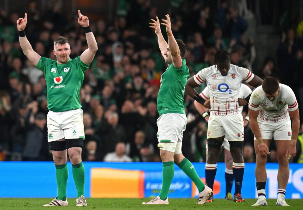 18 March 2023; Peter O'Mahony and Jack Conan of Ireland celebrate at the full-time whistle as Maro Itoje and Henry Slade of England react after the Guinness Six Nations Rugby Championship match between Ireland and England at the Aviva Stadium in Dublin. Photo by Seb Daly/Sportsfile